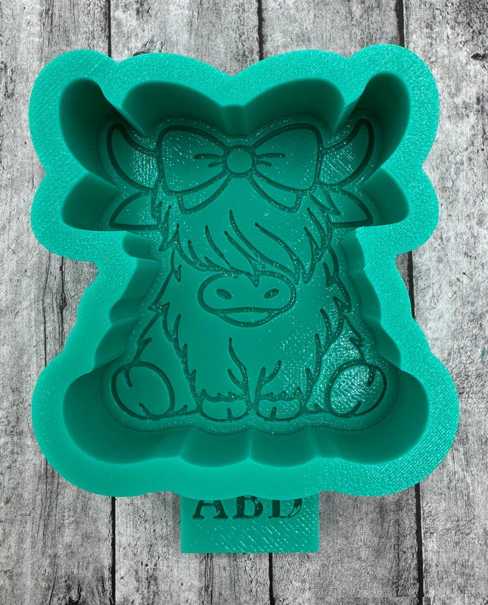 Mini Highland Cow with Bow Sitting Silicone Mold
