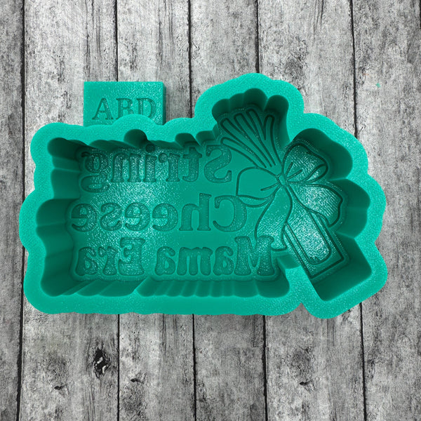 Green silicone mold with text  String Cheese Mama Era